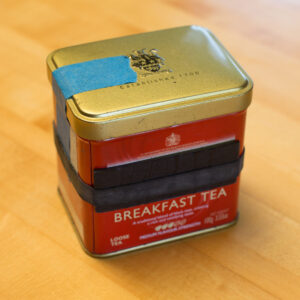 English Breakfast tea tin pinhole camera with magnet tape shutter made by San Diego photographer Chris Keeney