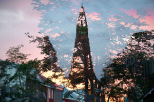 Experimental multiple exposure of the sunset, a tree and the Hallgrímskirkja church in Reykjavík, Iceland