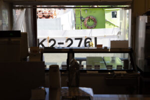 looking through store window at the fishing dock in Japan