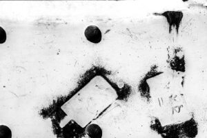 Black and white photography of paint on a wall in Nachikatsuura town in Japan