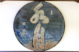 circular hand painted blue and white street sign with Japanese kanji and three artist marks (Rakkan-in)