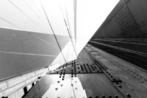 Black and white monochrome abstract of one of the main towers & suspension cables of the San Francisco Golden Gate Bridge in California